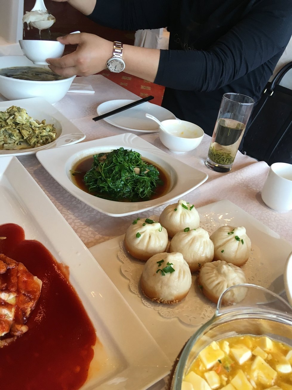 Several small plates of lunch food